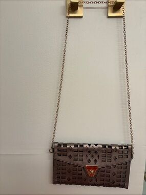 Metallic perforated crossbody/clutch
